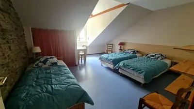 Un ou plusieurs lits dans un hébergement de l'établissement Gîte LE LOUP