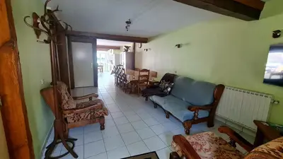 Coin salon dans l'établissement Gîte LA COUMERETTE