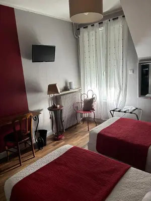 Un ou plusieurs lits dans un hébergement de l'établissement Hôtel Le Pont de l'Aube