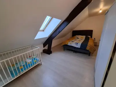 Un ou plusieurs lits dans un hébergement de l'établissement Gite de Guise, animaux bienvenus