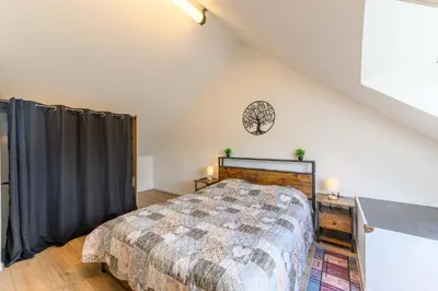 Un ou plusieurs lits dans un hébergement de l'établissement Le Duplex Mouroux - 30min de Disneyland