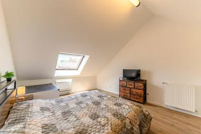 Un ou plusieurs lits dans un hébergement de l'établissement Le Duplex Mouroux - 30min de Disneyland