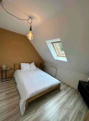 Un ou plusieurs lits dans un hébergement de l'établissement Pool House Champêtre