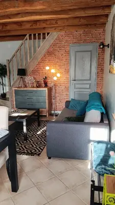 Coin salon dans l'établissement Au Nid Douillet