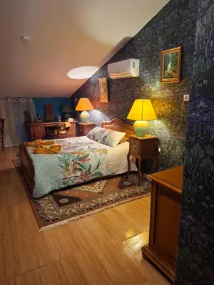 Un ou plusieurs lits dans un hébergement de l'établissement Maison spacieuse et calme