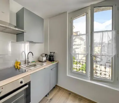 Cuisine ou kitchenette dans l'établissement Le City Chic