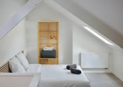 Un ou plusieurs lits dans un hébergement de l'établissement Le Duplex de l'Hôtel-de-Ville