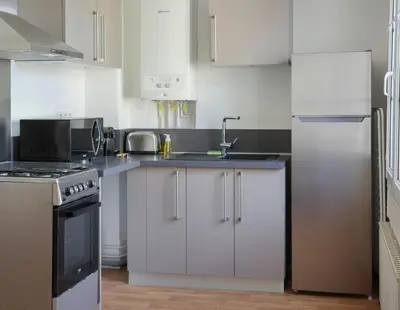 Cuisine ou kitchenette dans l'établissement Le Duplex de l'Hôtel-de-Ville