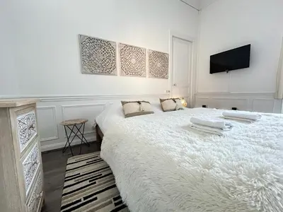 Un ou plusieurs lits dans un hébergement de l'établissement Le cœur de Reims magnifique 3 chambres au centre