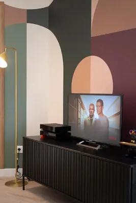 Télévision ou salle de divertissement dans l'établissement Le Nid Urbain - Center - Ground floor