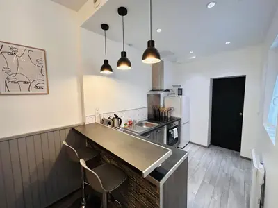 Cuisine ou kitchenette dans l'établissement La Suite Pierret Gare centre