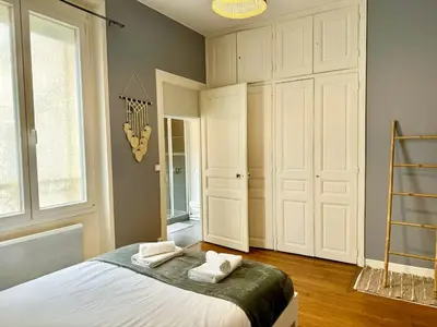 Un ou plusieurs lits dans un hébergement de l'établissement Appartement Colbert