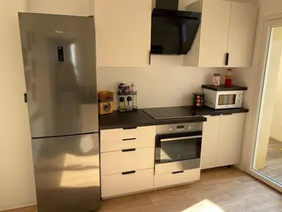 Cuisine ou kitchenette dans l'établissement Au Petit Crecy