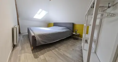 Un ou plusieurs lits dans un hébergement de l'établissement Appartement 2 chambres