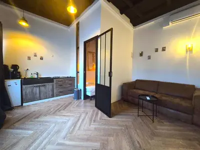 Coin salon dans l'établissement Georgie, Appartement calme & chaleureux