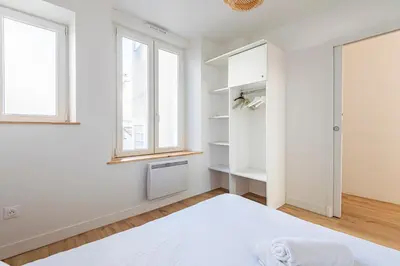 Un ou plusieurs lits dans un hébergement de l'établissement Moderne appartement 4 pers