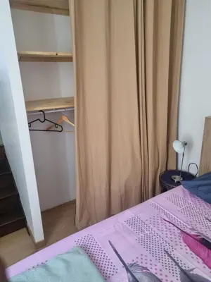Un ou plusieurs lits dans un hébergement de l'établissement Apparemment deux chambres