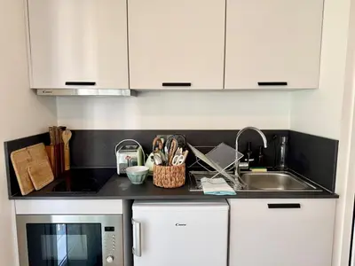 Cuisine ou kitchenette dans l'établissement We Live Inn Sharies Reims - C202