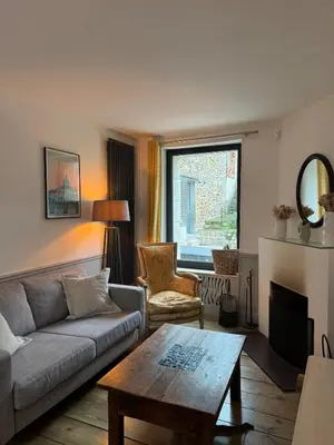 Coin salon dans l'établissement Charming House