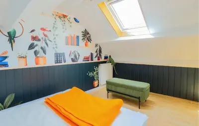 Un ou plusieurs lits dans un hébergement de l'établissement Jolie Maison Proche Rivière