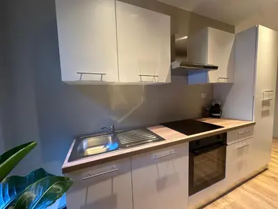 Cuisine ou kitchenette dans l'établissement Suite Lumière - Cinéma privé by Collection Aura - Hypercentre Charleville-Mézières
