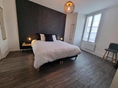 Un ou plusieurs lits dans un hébergement de l'établissement Appartement cosy