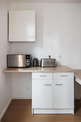 Cuisine ou kitchenette dans l'établissement Evasion Prestige - Duplex Balnéo, Sauna & Billard