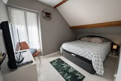 Un ou plusieurs lits dans un hébergement de l'établissement Cosy Garden DisneyLand