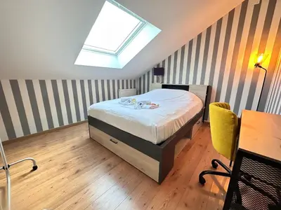 Un ou plusieurs lits dans un hébergement de l'établissement La maison champenoise 4 chambres avec terrasse
