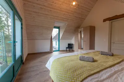 Un ou plusieurs lits dans un hébergement de l'établissement Aux hirondelles du Chêne, Maison Ecureuil