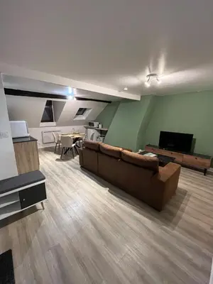 Télévision ou salle de divertissement dans l'établissement Cocon Bourbon