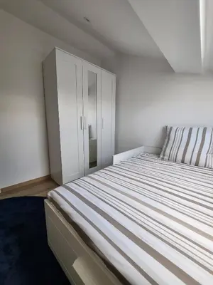 Un ou plusieurs lits dans un hébergement de l'établissement T3 R&B - Hyper Centre - 2 chambres - 6 personnes avec terrasse