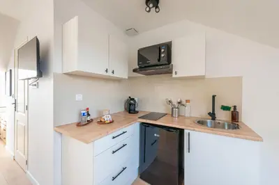 Cuisine ou kitchenette dans l'établissement Casa 159 - SAINT QUENTIN