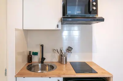 Cuisine ou kitchenette dans l'établissement Casa 159 - SAINT QUENTIN