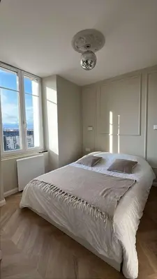 Un ou plusieurs lits dans un hébergement de l'établissement Studio moderne au pied de la Cathédrale de Reims