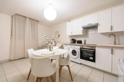 Cuisine ou kitchenette dans l'établissement Le Nid de la Fauvette - Hyper Centre
