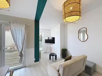 Télévision ou salle de divertissement dans l'établissement La Capsule - Centre - Terrasse