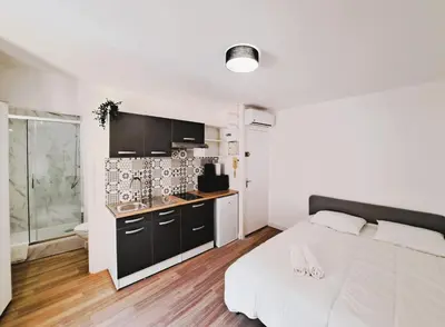 Un ou plusieurs lits dans un hébergement de l'établissement Palerme - 2P - confortable studio