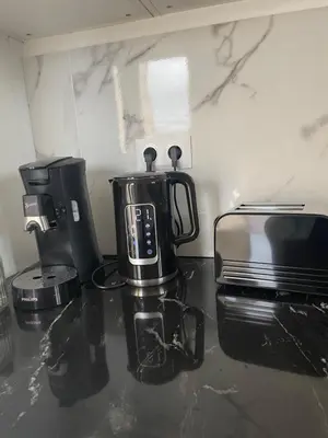 Cuisine ou kitchenette dans l'établissement Hébergement familial dans un environnement calme