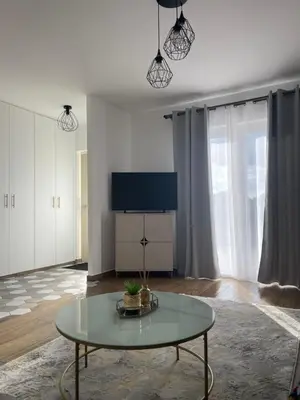 Télévision ou salle de divertissement dans l'établissement Hébergement familial dans un environnement calme