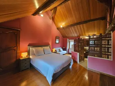 Un ou plusieurs lits dans un hébergement de l'établissement Villa familiale La Finca du champ de l'eau Avec sauna jacuzzi proche de Disney et Paris