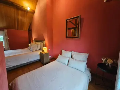 Un ou plusieurs lits dans un hébergement de l'établissement Villa familiale La Finca du champ de l'eau Avec sauna jacuzzi proche de Disney et Paris