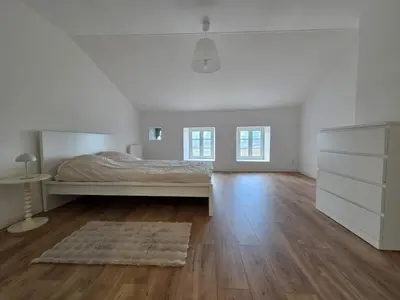 Un ou plusieurs lits dans un hébergement de l'établissement Charmante maison de pierre rénovée a 5min de Charleville-Mézières