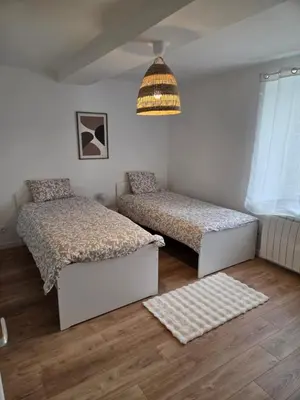 Un ou plusieurs lits dans un hébergement de l'établissement Charmante maison de pierre rénovée a 5min de Charleville-Mézières