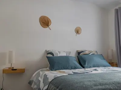 Un ou plusieurs lits dans un hébergement de l'établissement Duplex au coeur de Reims - 2 chambres