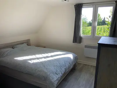 Un ou plusieurs lits dans un hébergement de l'établissement Cozy family home in Champagne-en-Ardenne 8p