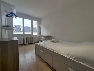 Un ou plusieurs lits dans un hébergement de l'établissement Dubaï - Élégant logement rémois - 10P