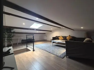 Coin salon dans l'établissement Dubaï - Élégant logement rémois - 10P