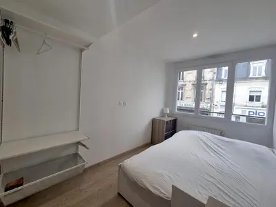Un ou plusieurs lits dans un hébergement de l'établissement Dubaï - Élégant logement rémois - 10P