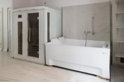 Salle de bains dans l'établissement Evasion Prestige - Suite Spa, Sauna & Patio